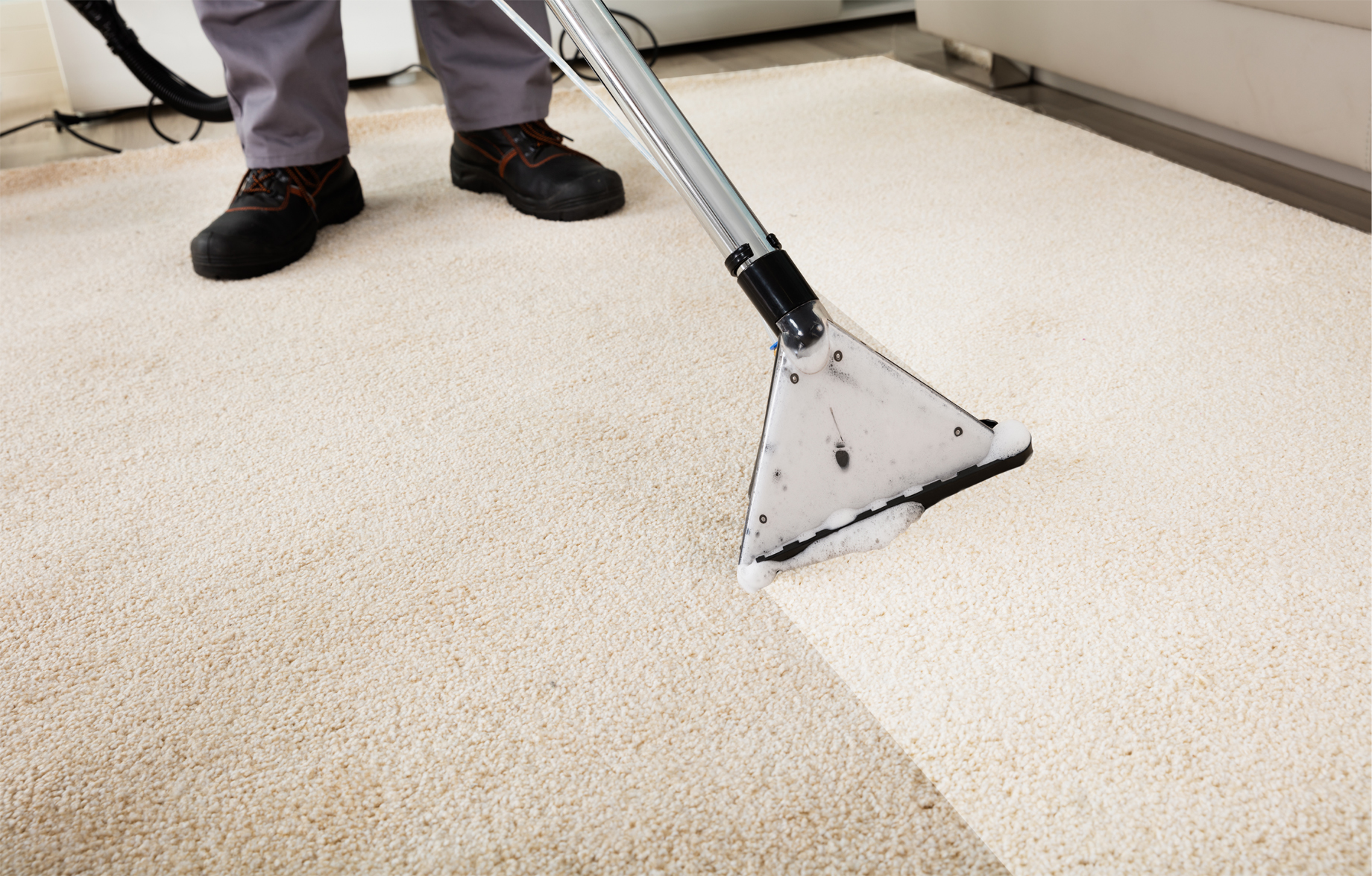 A man washing a carpet