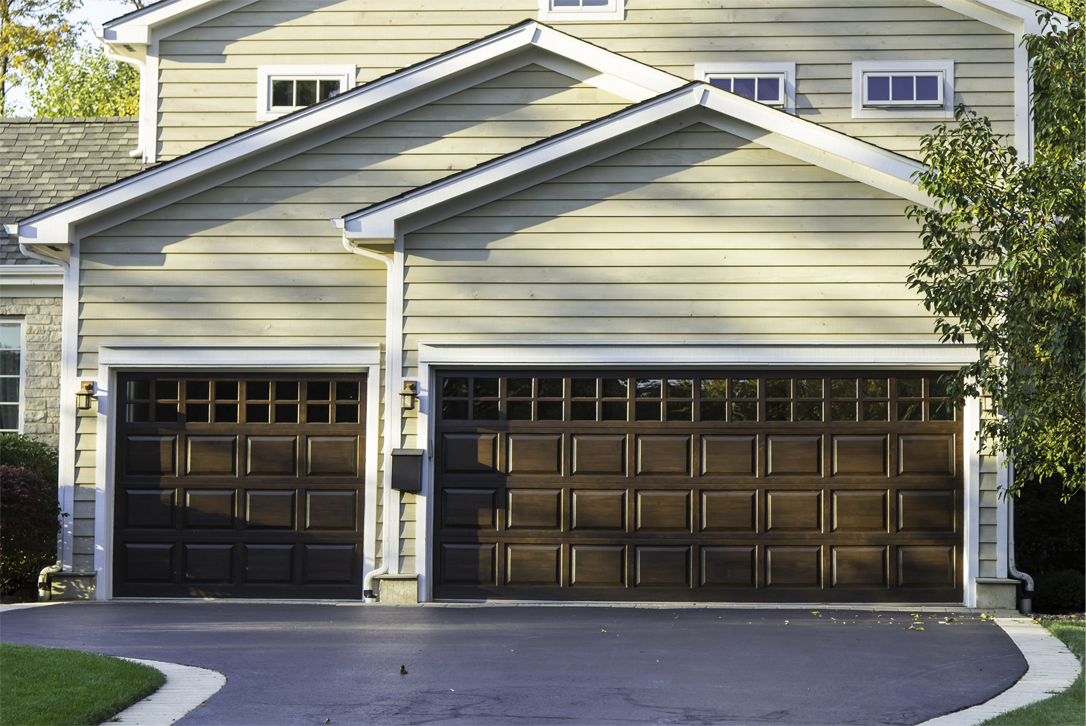 A driveway leading up to a 3-car garage